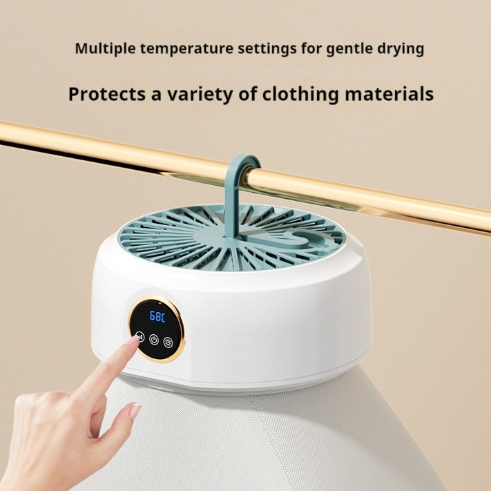 Foldable electric dryer for small garments, ideal for travel and small spaces.